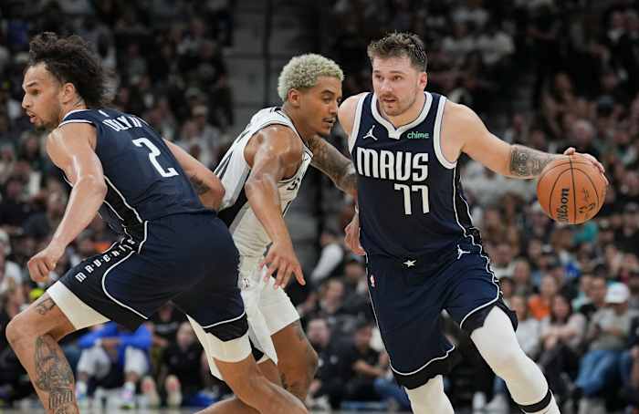 Luka Doncic and Dereck Lively II execute a pick-and-roll in the Dallas Mavericks' win over the San Antonio Spurs.